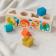 Wooden shape sorter toy featuring colourful illustrations of wild animals