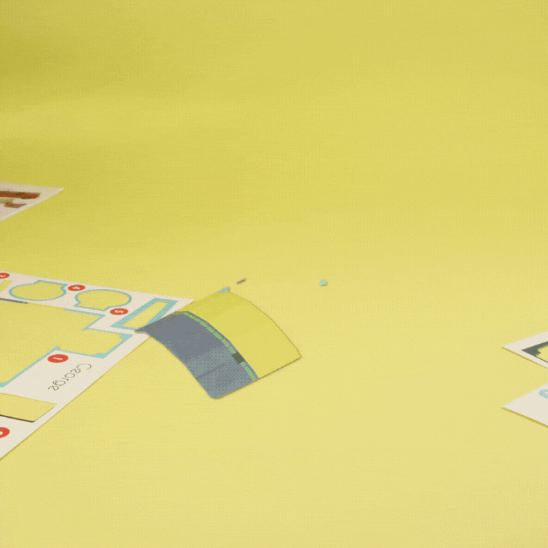 A stop motion video of a paper craft set transforming into animals