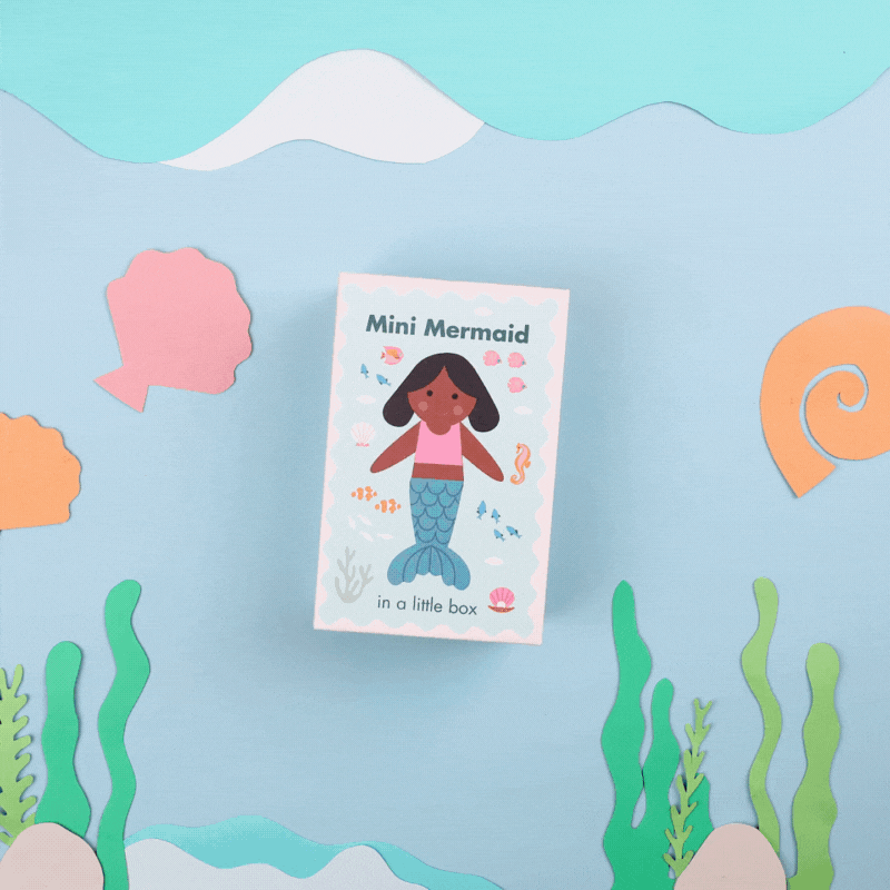A stop motion video of a mermaid toy swimming out of a box