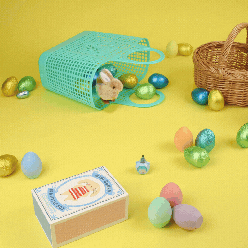 A stop motion gif of three toys bunnies hopping on yellow background with colourful eggs