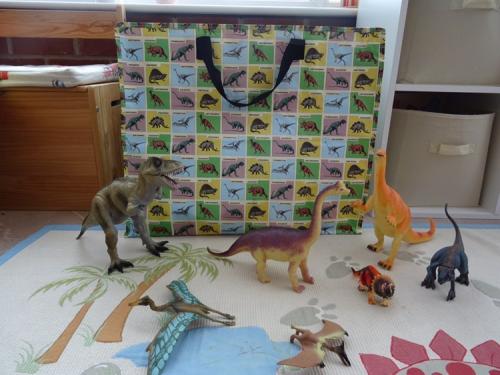 Dino toys in front of Prehistoric Land jumbo bag 