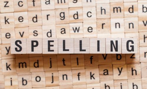 stock image of a spelling block  stock image of a spelling block with letters behind it