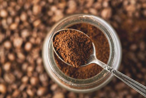 glass jar of ground coffee