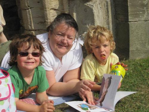Jen and her boys reading in the park Jen and her boys reading in the park