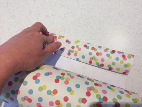 step 3 wrapping cylindrical gifts