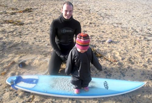 Andrew, daughter and surfboard