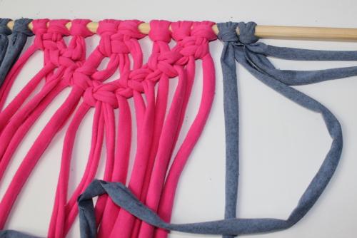 a blue lead cord being tied into the first diagonal line
