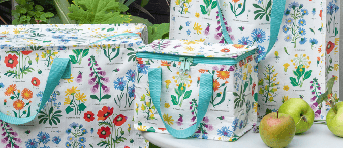 Jumbo storage bag, shopping bag and lunch bag in a Wild Flowers design, with a foliage background