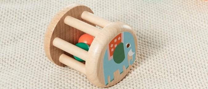 Wooden rattle with an elephant painted on