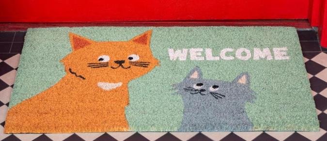 Coir doormat with two cats and the word 'welcome'