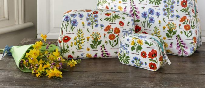 Wild Flowers bags on a table with some yellow flowers