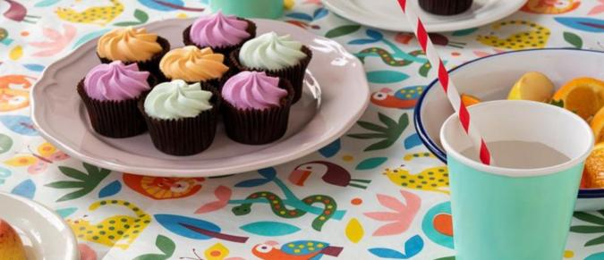 Wild Wonders table cover with a plate of cupcakes and a party drink