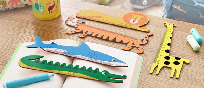 Wooden animal-shaped rulers on a desk