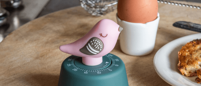 Bird shaped timer next to egg 