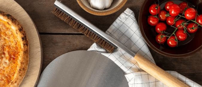 Pizza tools with tomatoes, garlic and pizza