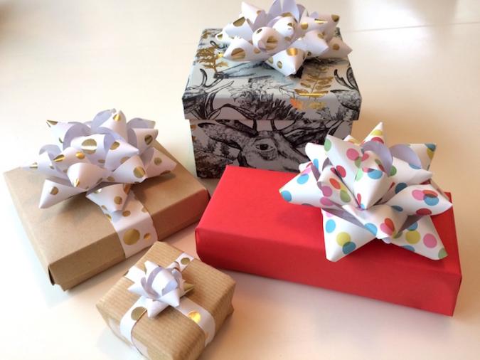 Beautifully wrapped Christmas gifts with homemade bows