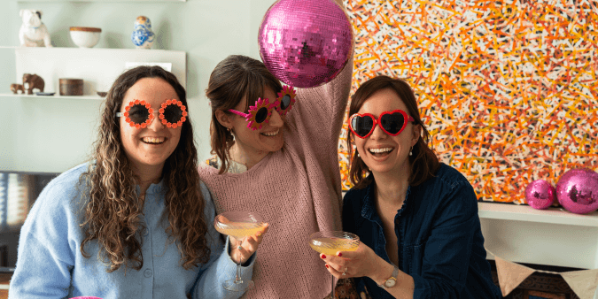 3 women laughing and smile together