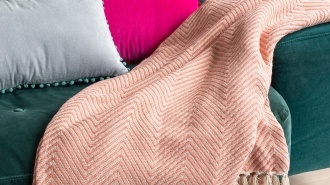 Coral herringbone throw
