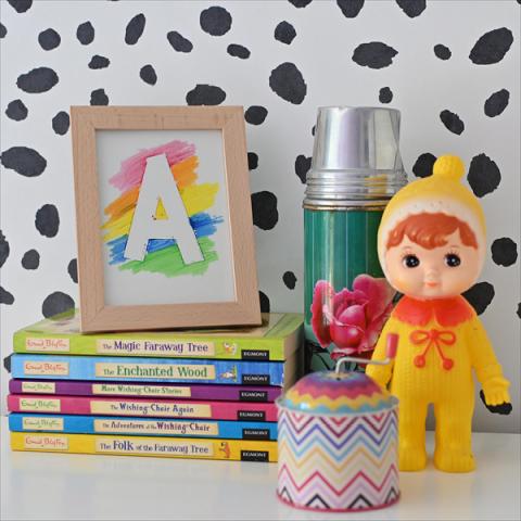 masking tape crayon letter resist picture on a children's bedside table