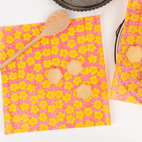 Buttercup greaseproof paper with homemade biscuits