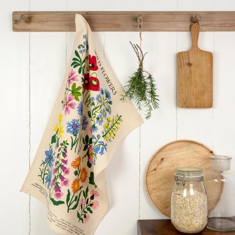 Wild Flowers tea towel hanging on a kitchen hook