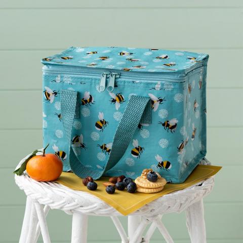 Bumblebee lunch bag on a stool next to some fruit and snacks