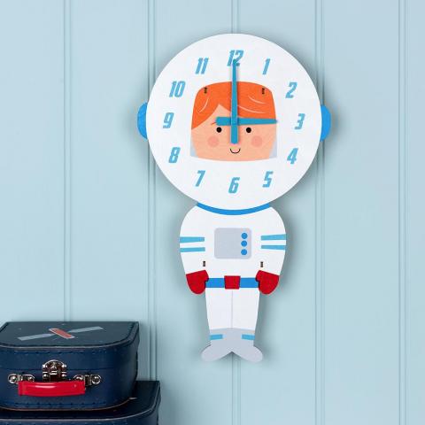 Astronaut wooden clock on a blue background