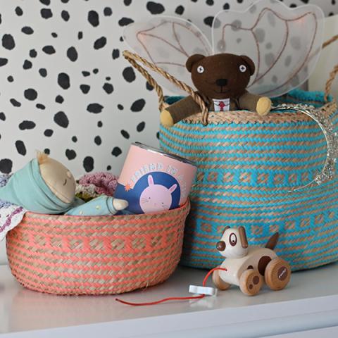 Colourful belly baskets filled with children's toys