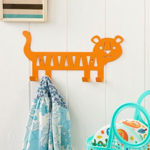 Orange metal wall hanger shaped like a tiger