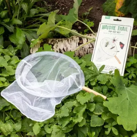 Pop out net placed outdoors surrounded by greenery 