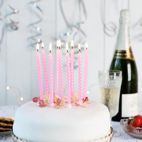 cake with candles and champagne