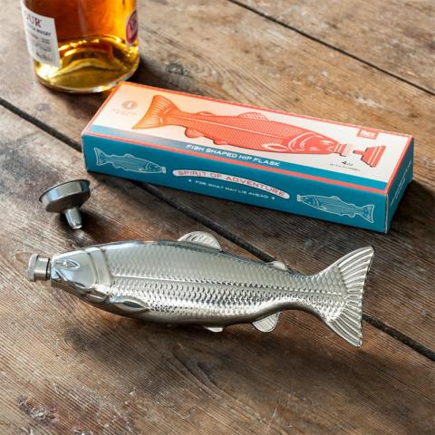 Fish hip flask on table