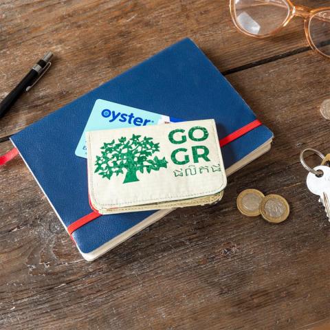Recycled coin purse on notebook