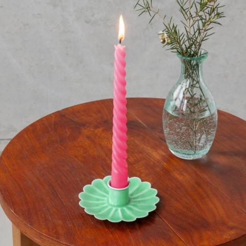 Green candle holder with pink candle