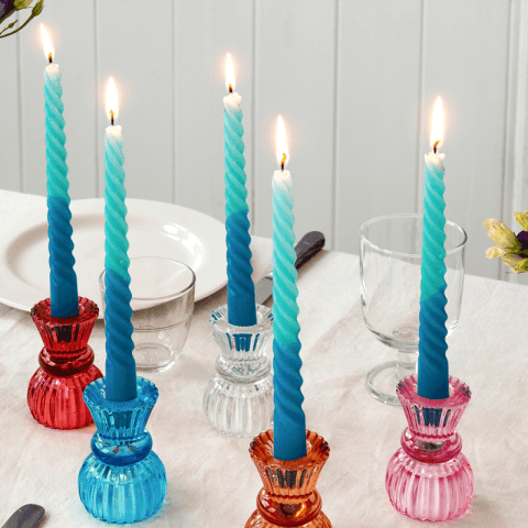 4 blue candles on table