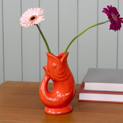 Orange fish vase with two flowers