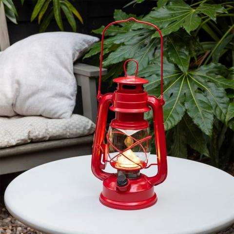 Red lantern on table outside