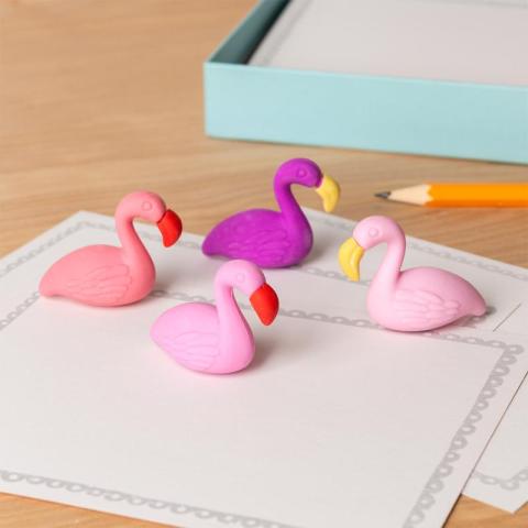4 flamingo erasers on table