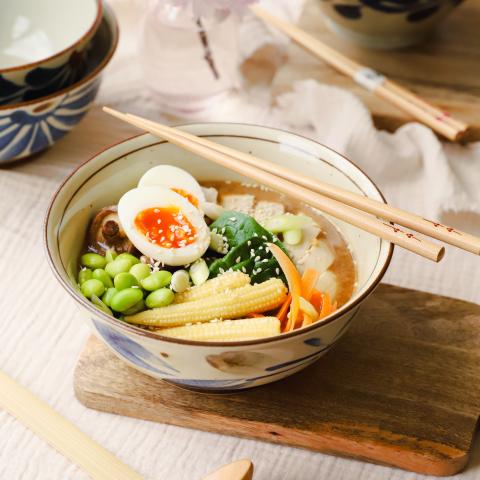 Ramen in a bowl with chopsticks
