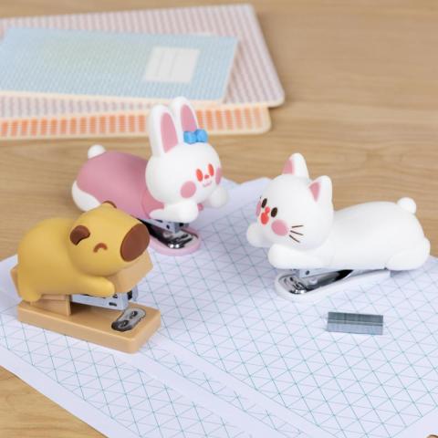 3 different animal mini stapes on white paper on wooden desk