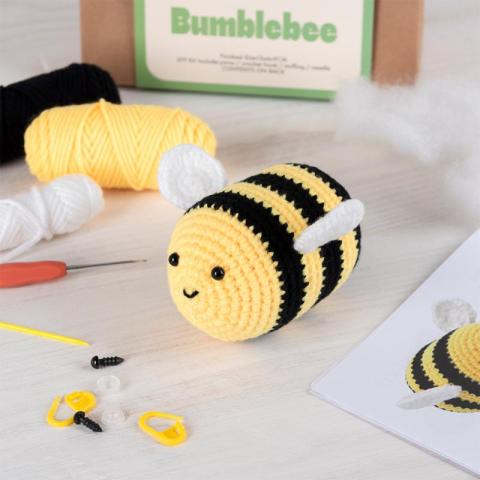 Yellow and black bee with wool and needles