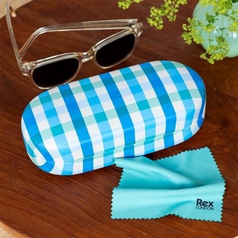 Blue gingham-patterned sunglasses case with cleaning cloth on a wooden table.
