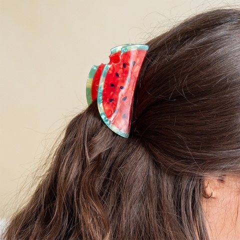 Hair claw clip featuring a fruity watermelon slice design, with hints of marbling and translucence. 
