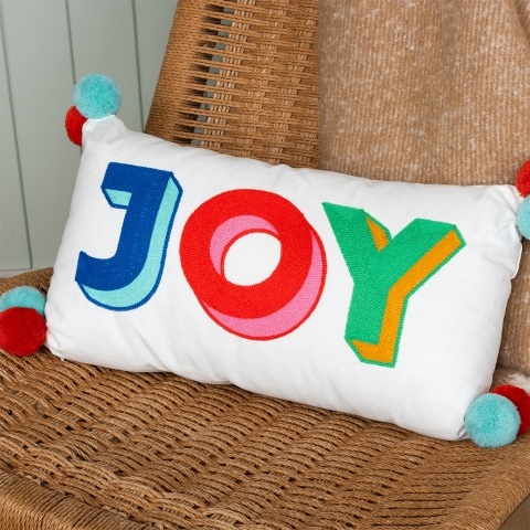 Cushion with pompoms