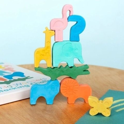 Wooden animal stacking toy, with a lion, monkey, crocodile, elephant, giraffe and flamingo balanced in a tower.