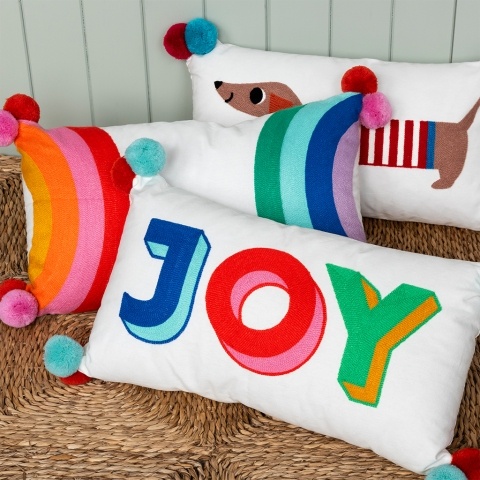 Cushion with pom poms