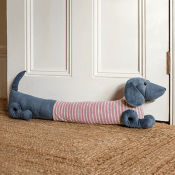 Pink jumper sausage dog draught excluder