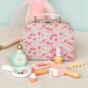 Packed in a sweet floral case - lipstick and perfume to a mirror and comb.