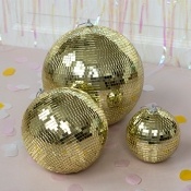 Bright gold disco balls. Its reflective mirror surface catches the light beautifully, creating a dazzling effect on every wall.