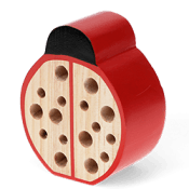 Ladybird-shaped bug hotel with a red body and black spots.